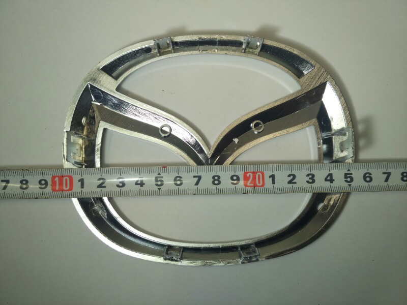Эмблема решетки радиатора Mazda Atenza Sport GJ