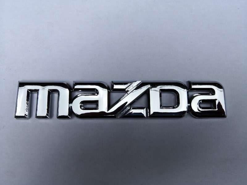 Эмблема багажника Mazda Axela BK3P новая