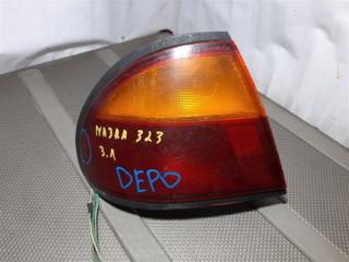 Запчасть фонарь задний левый Mazda 323 1994