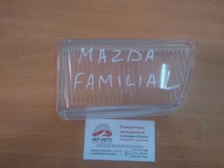 Запчасть стекло противотуманной фары переднее левое MAZDA Familia 1990